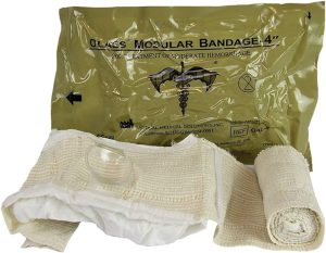 Olaes dressing open showing pad, compression cup and bandage