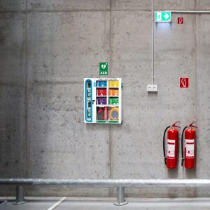 Modulator first aid station mounted on a warehouse wall