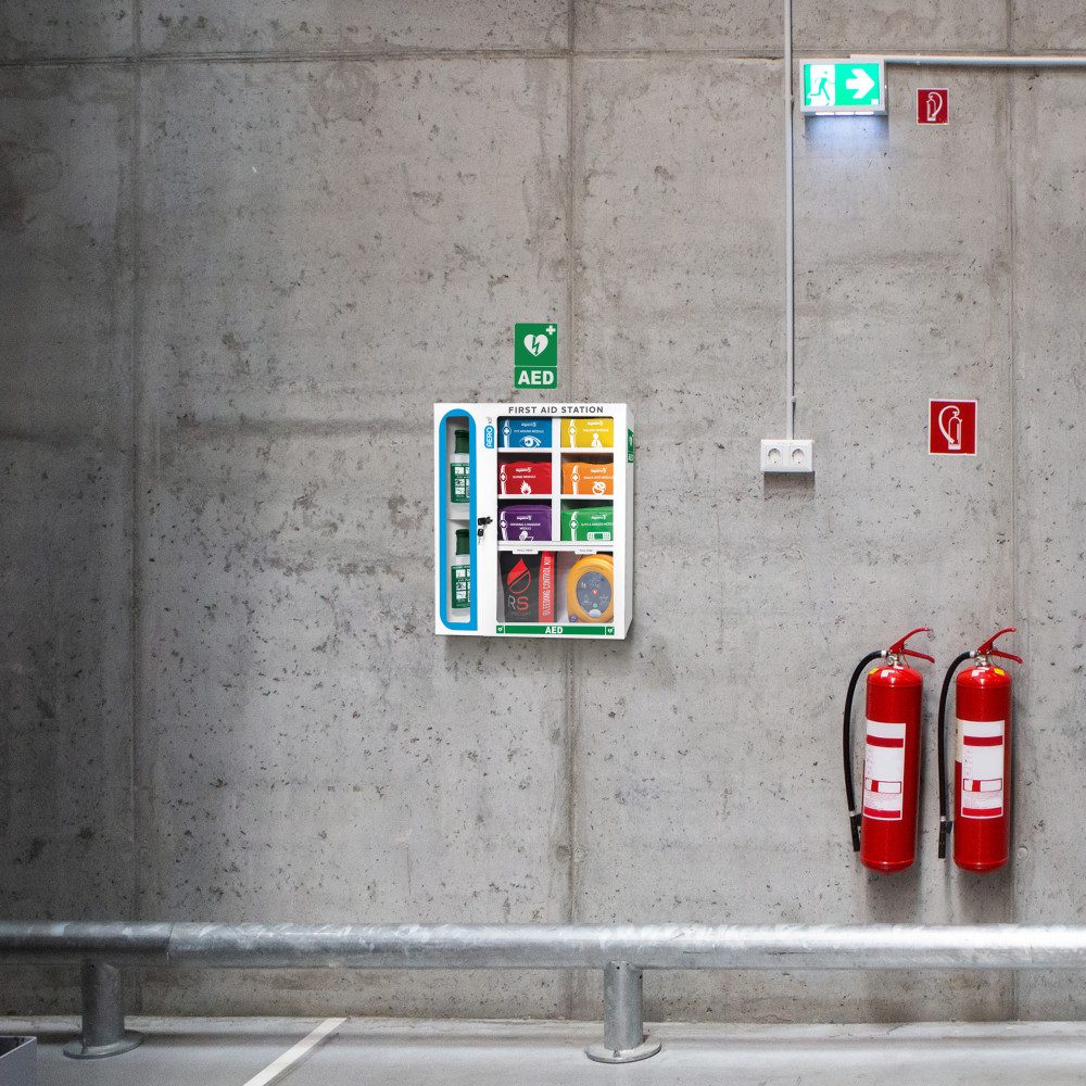 Modulator first aid station mounted on a warehouse wall
