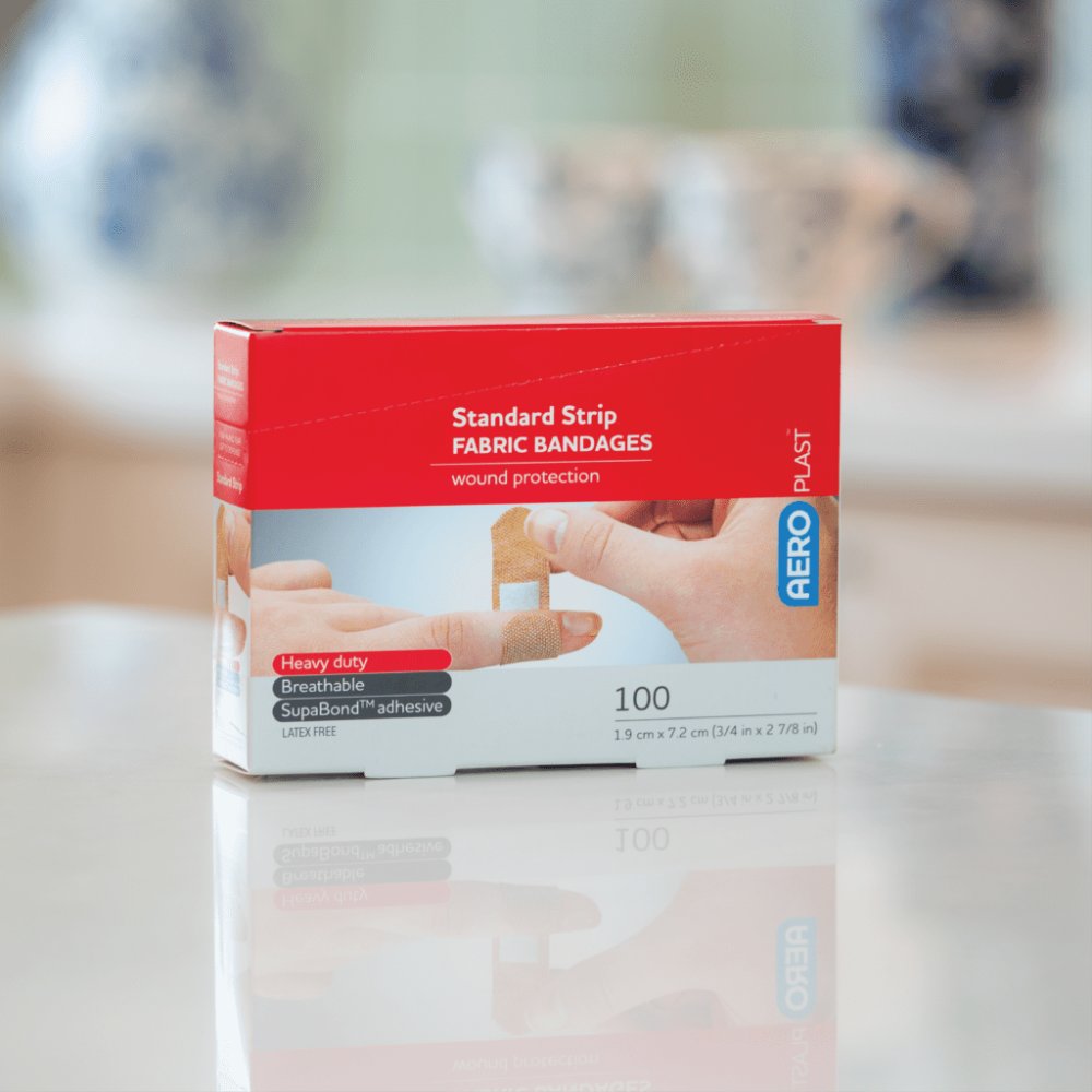 Box of 100 AeroPlast fabric bandaids on a kitchen bench, ready for home first aid