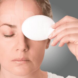 Oval white eye pad covering one eye