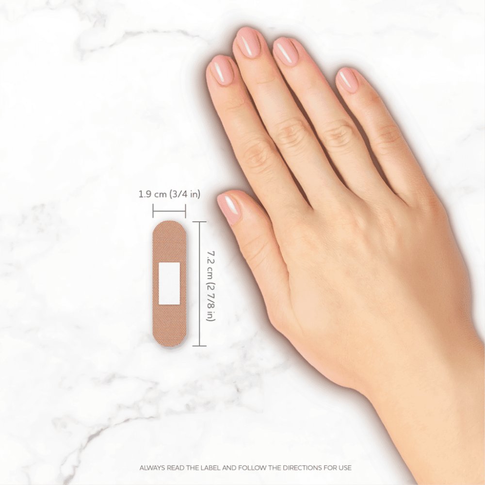 AeroPlast fabric bandaid standard strip on the back of a hand with 7.2cm x 1.9cm dimensions marked